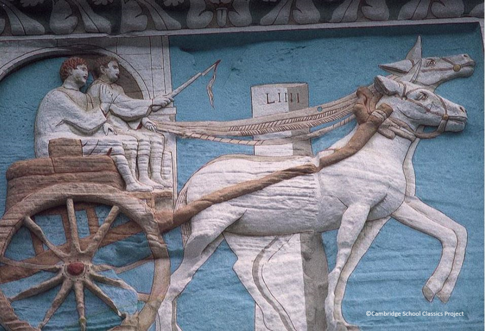 Stone relief picturing two figures, one of whom holds the reins and a whip, travelling in a horse-drawn cart past a milestone against a blue background.