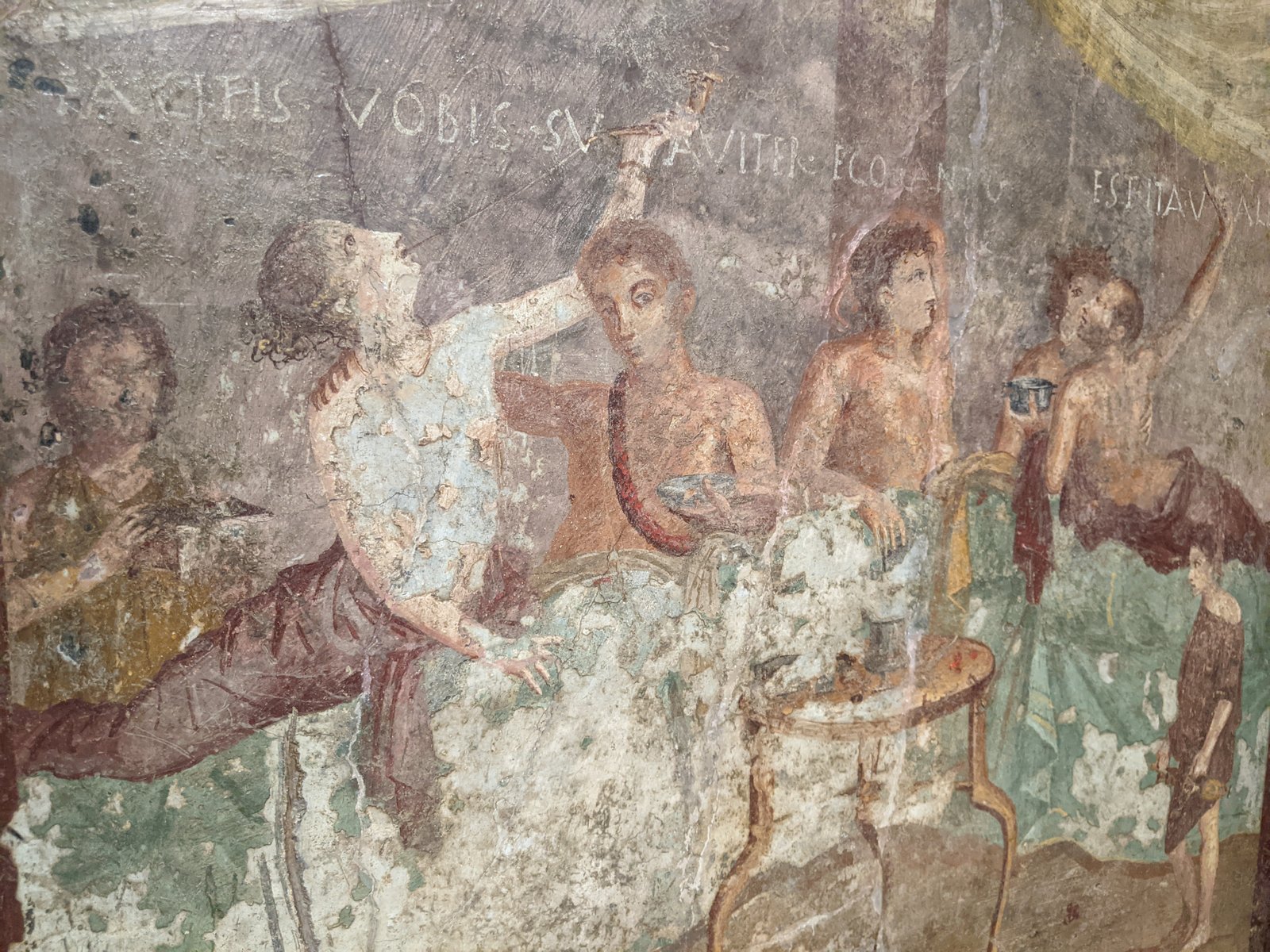 Fresco from the Praedia of Julia Felix, Pompeii showing a glass bowl of apples, grapes and pomegranates, a jar of wine and a jar of raisins.